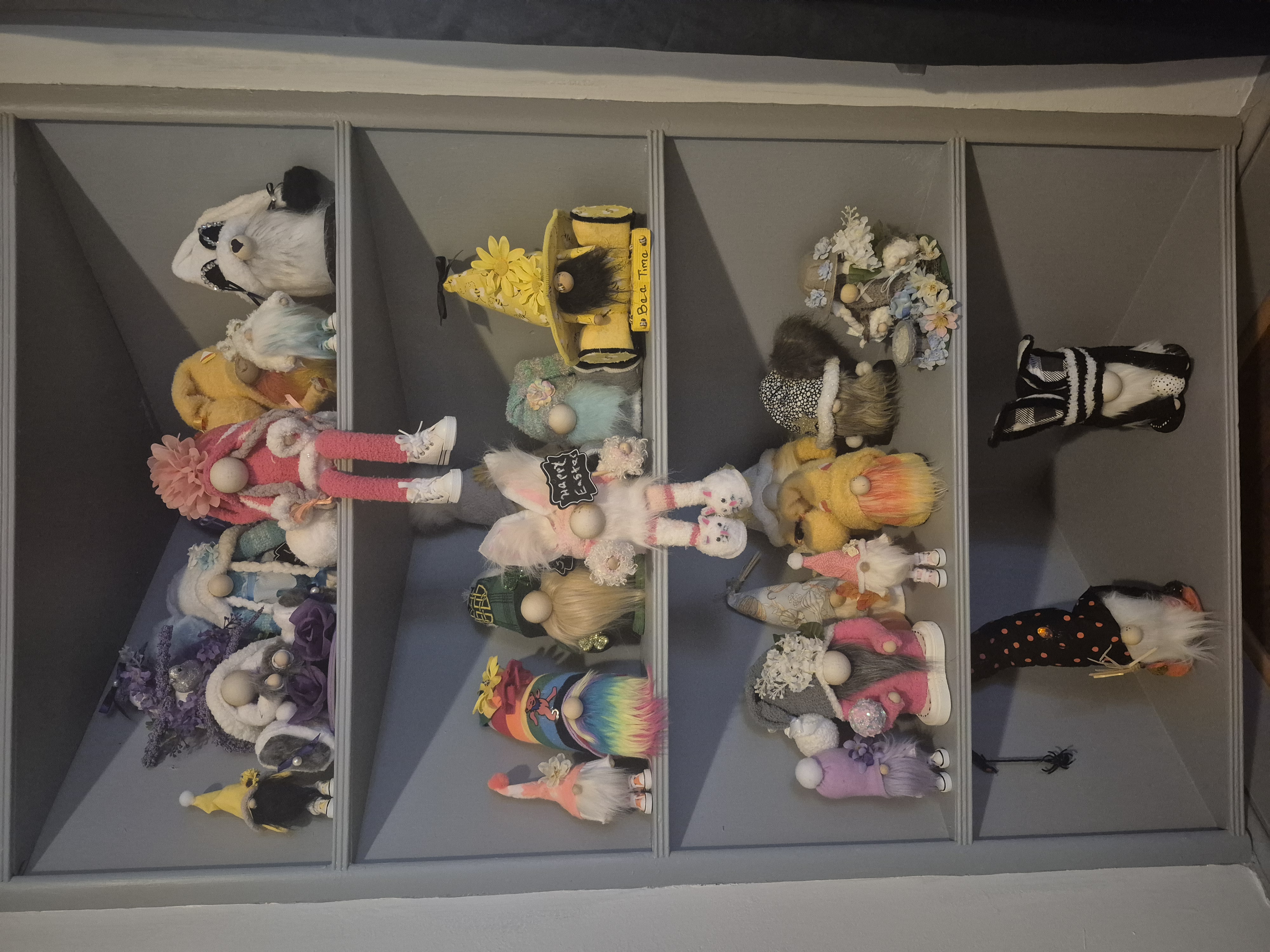 The full Gnome Collection by Crafts by Randi — shelves of handmade gnomes