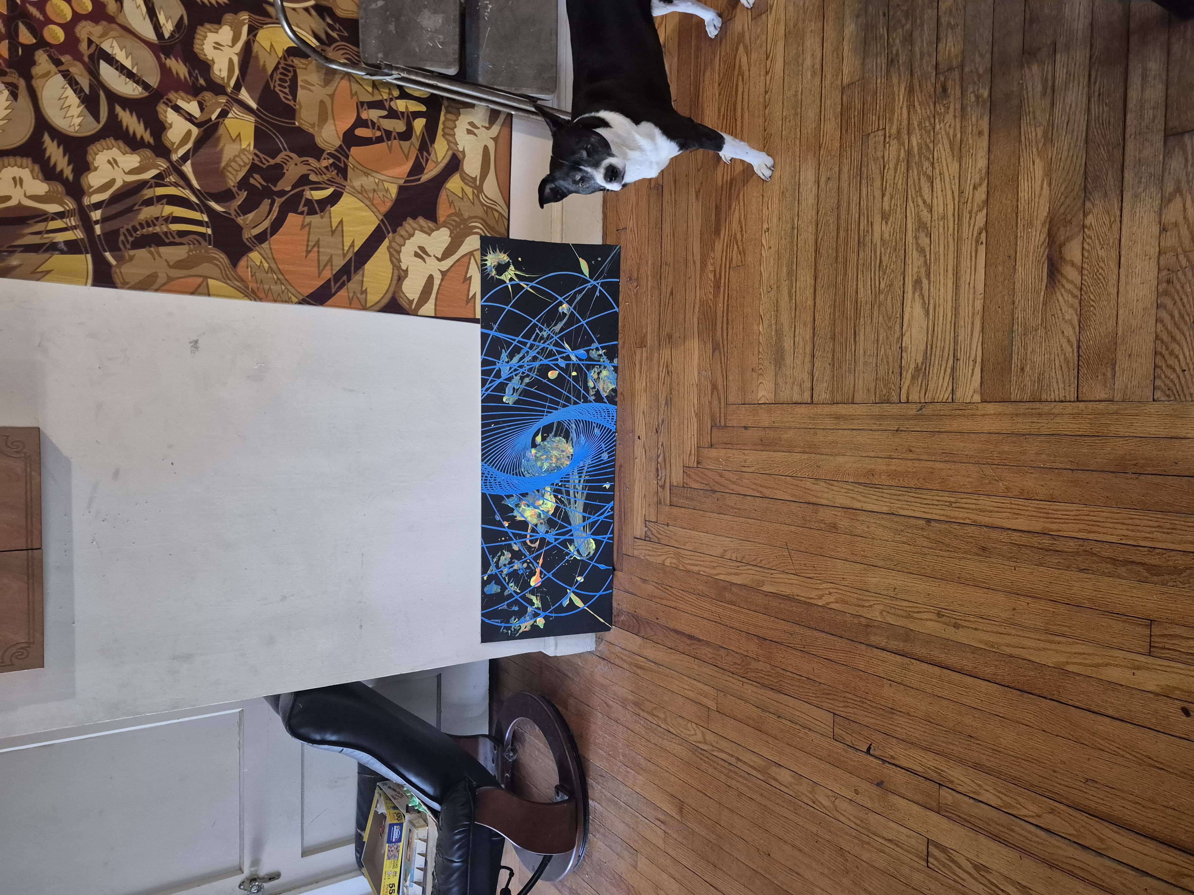 Galexy Far canvas on the studio floor with Xina the dog