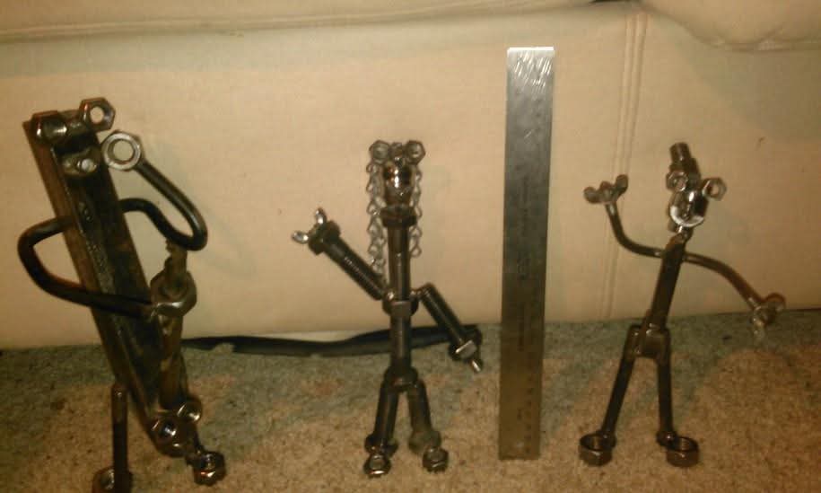 Lineup of three welded nut-and-bolt figures
